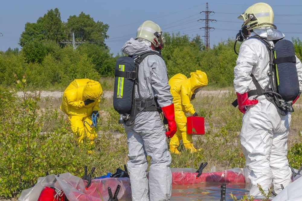 Industrial Hygiene Support for Hazardous Waste Operations - team wearing protective equipment doing an important survey of land