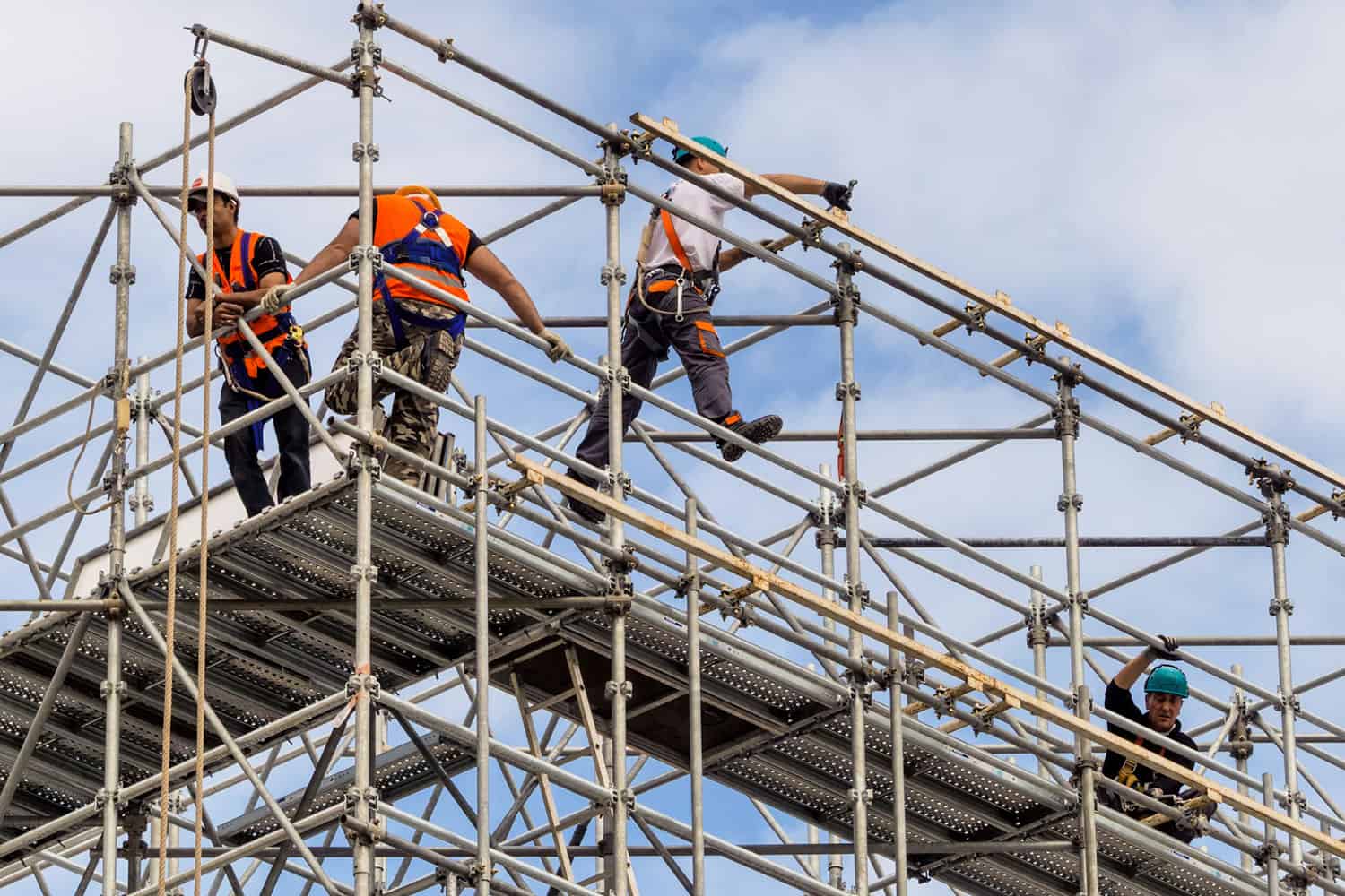 Occupational Safety Consulting - Industrial Hygiene Services - construction team working on the top of a scaffolding